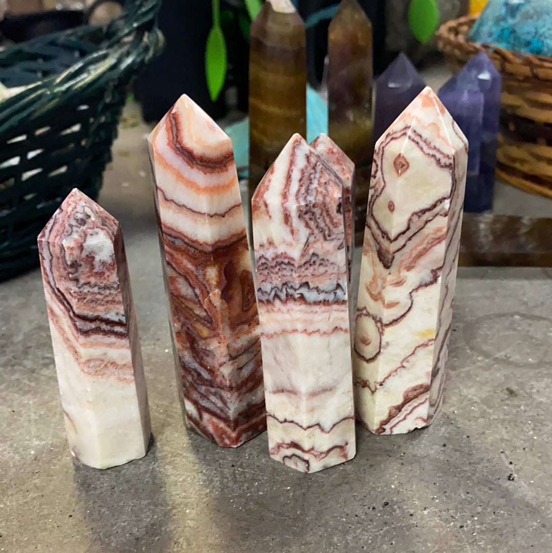 banded red Calcite point.